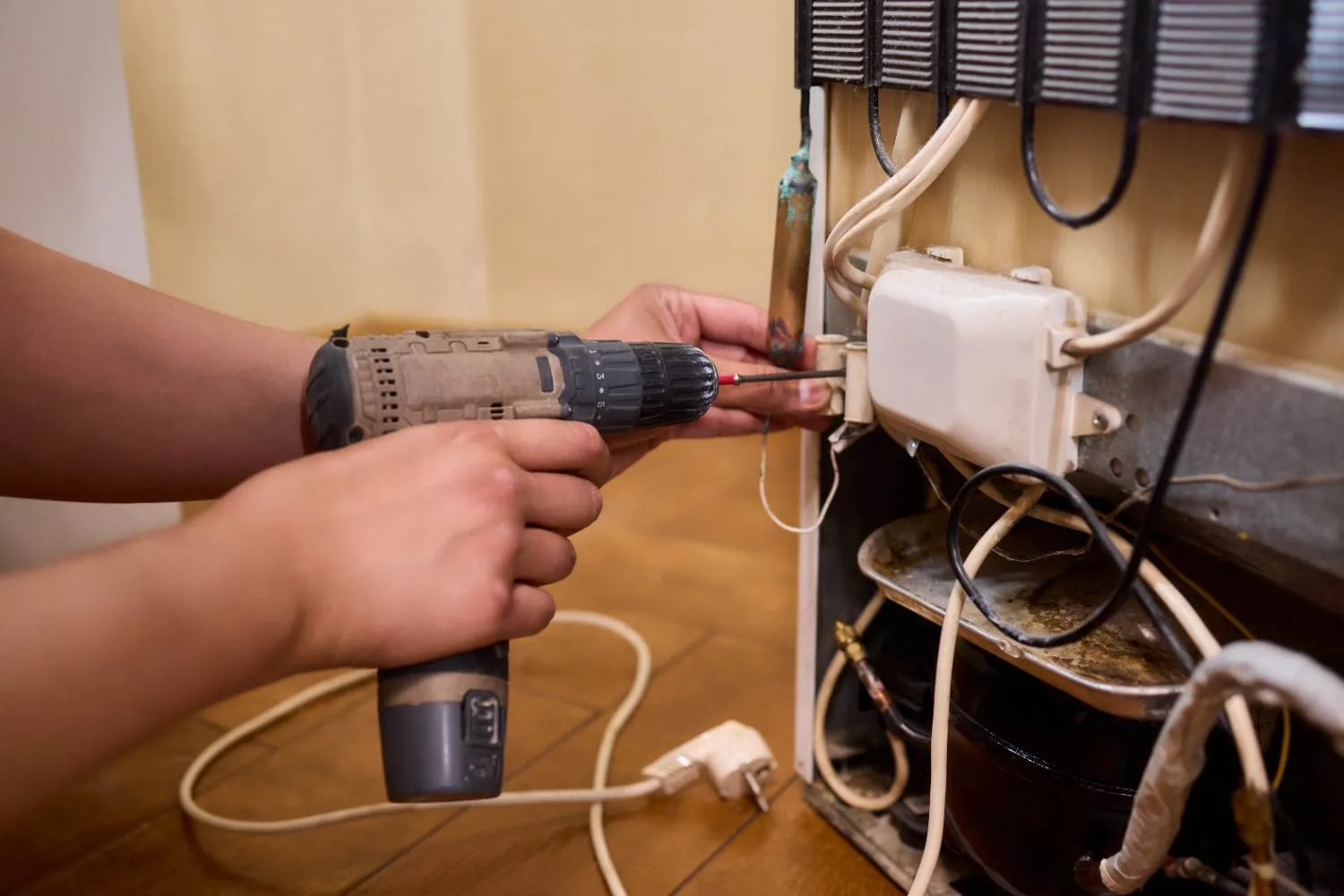 A homeowner looking over a household appliance